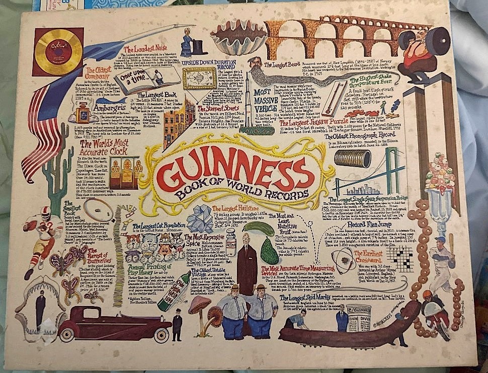An illustrated montage featuring the Guinness Book of World Records logo surrounded by various record-breaking trivia facts.