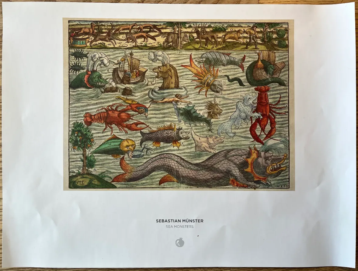 An antique-style illustration depicting a variety of fantastical sea monsters and ships in a turbulent ocean.