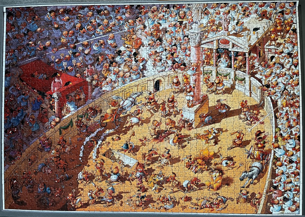 Cartoon illustration of a chaotic Roman coliseum scene with gladiators, chariots, and a crowd.