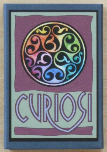 A circular Celtic-style knot design with a rainbow spectrum on a purple and green background.
