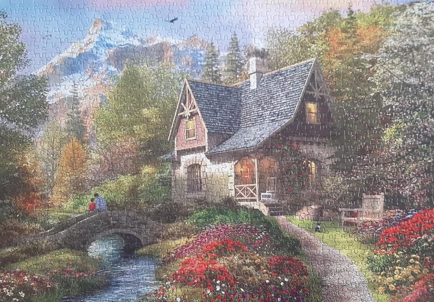 A cottage scene with a stone bridge, a flowing stream, and mountains in the background, illustrated in a pastoral style.