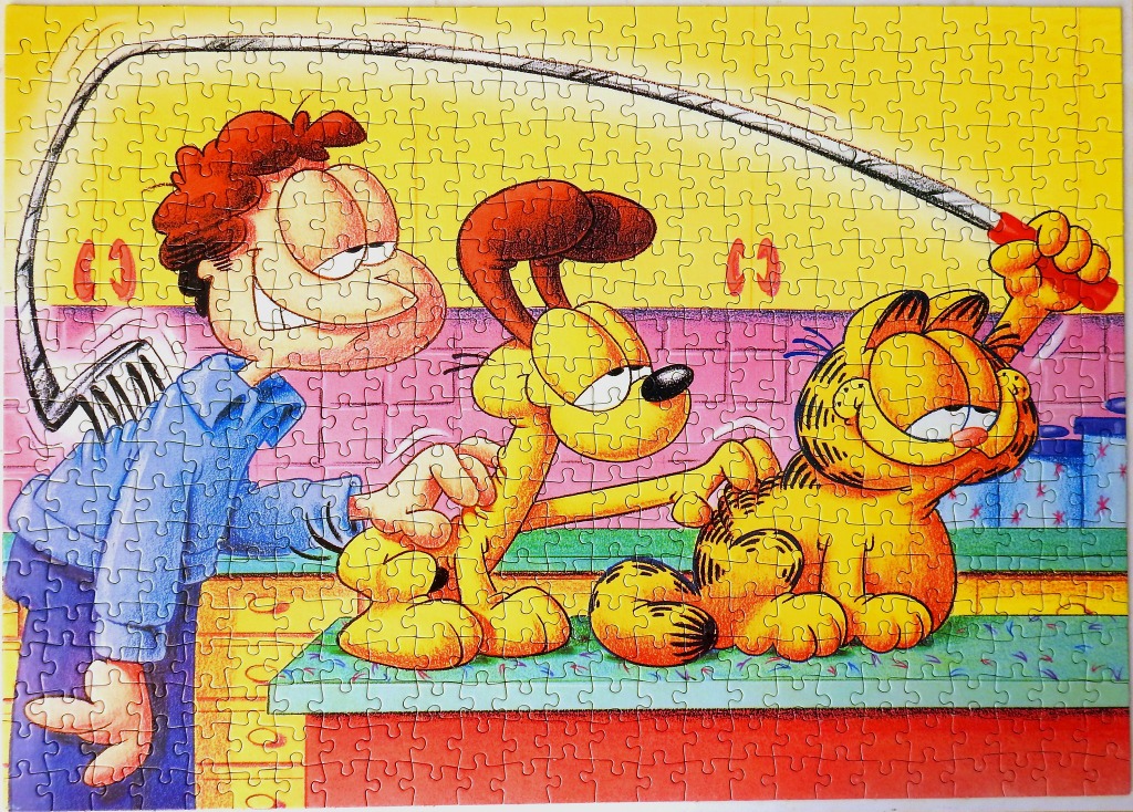 Jon Arbuckle, Odie, and Garfield in a kitchen scene with a flyswatter