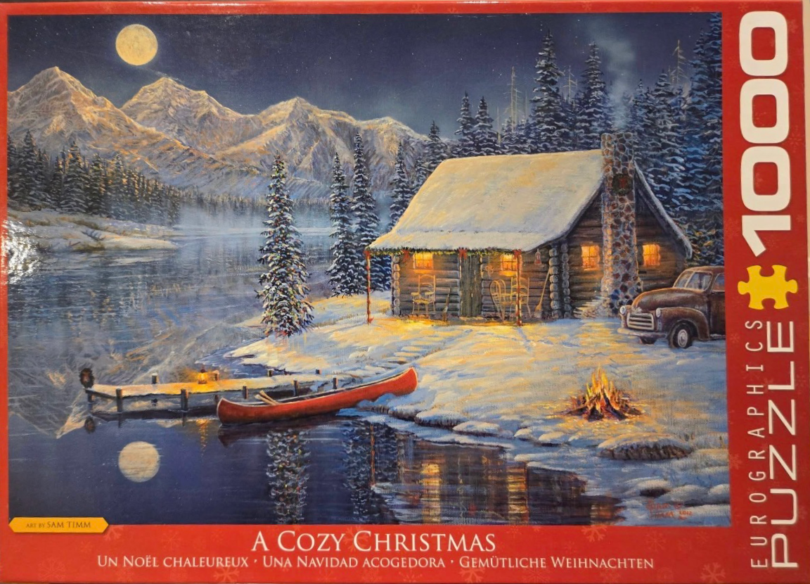 A snow-covered log cabin beside a frozen lake at night under a full moon, with a red canoe, fire, and vintage truck.