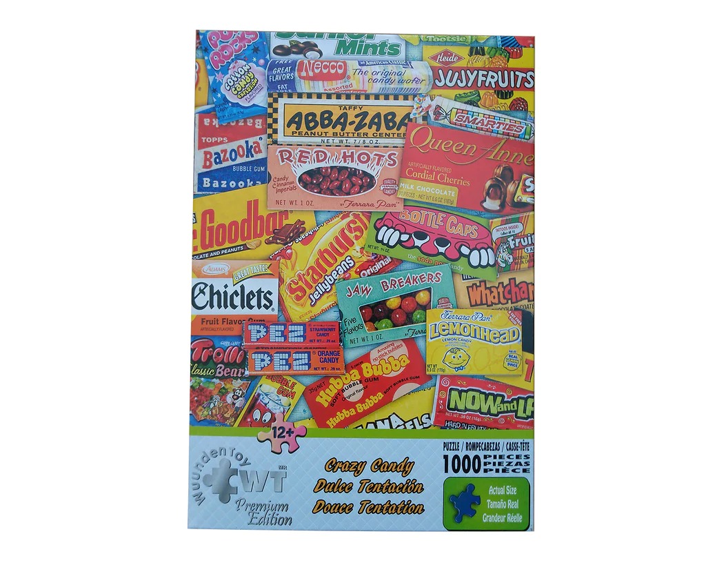 A collage of various colorful vintage candy wrappers and boxes arranged in a dense pile.