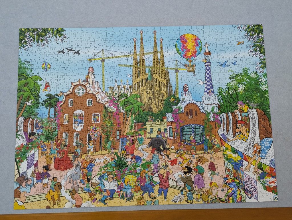 Busy cartoon scene featuring Barcelona's Sagrada Familia and Park Guell elements with many tourists.