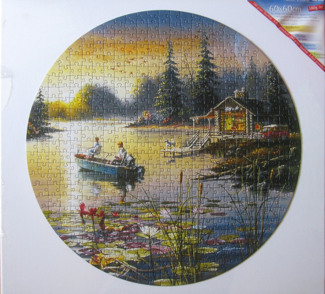 Circular illustration of a peaceful lake scene with a log cabin, boaters, and lily pads at sunset.