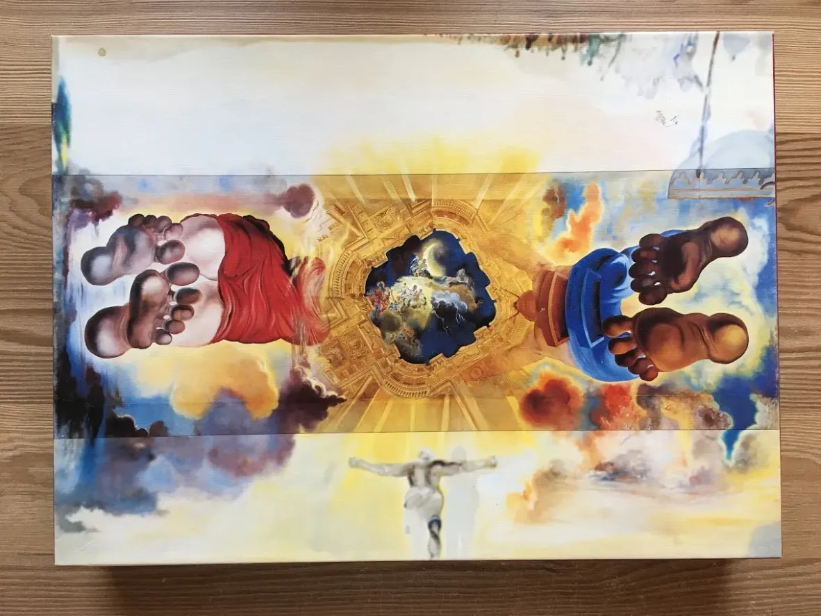 Surrealist painting by Salvador Dali titled 'Santiago El Grande' showing giant feet and a central celestial portal.