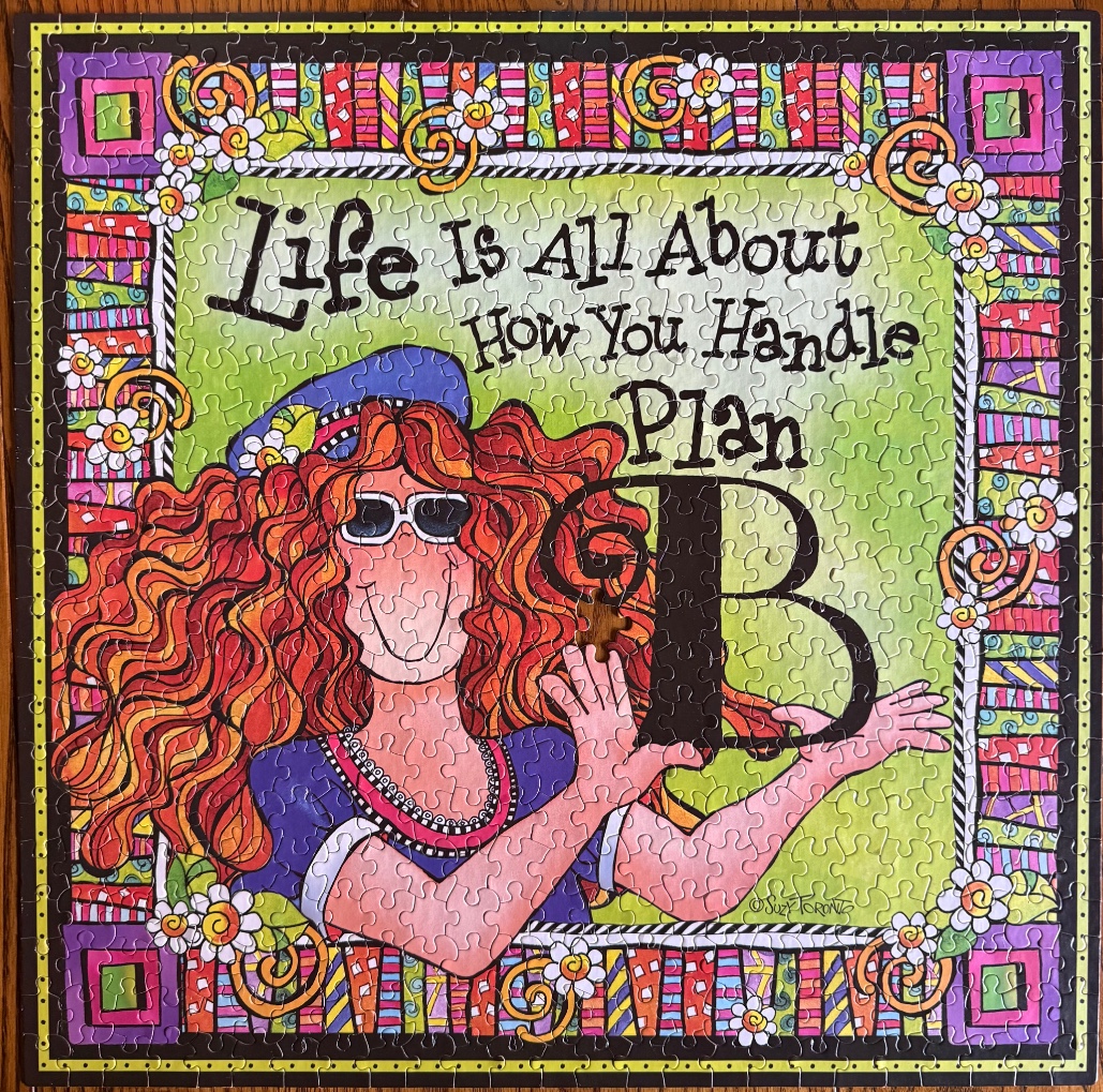 Illustration of a woman with red hair and the text Life Is All About How You Handle Plan B