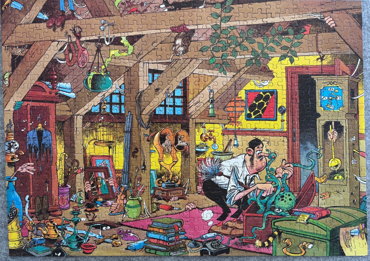Cartoon illustration of a cluttered attic room with a man interacting with a green octopus-like creature.