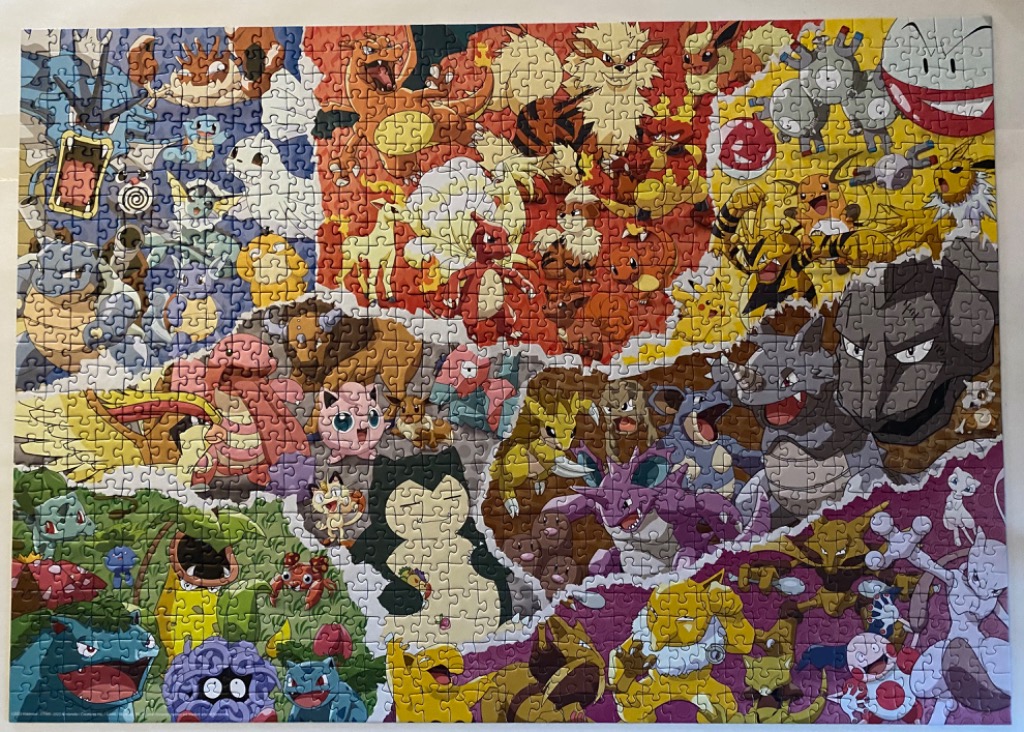 A montage of dozens of Pokémon characters arranged in a vibrant color-coded collage.