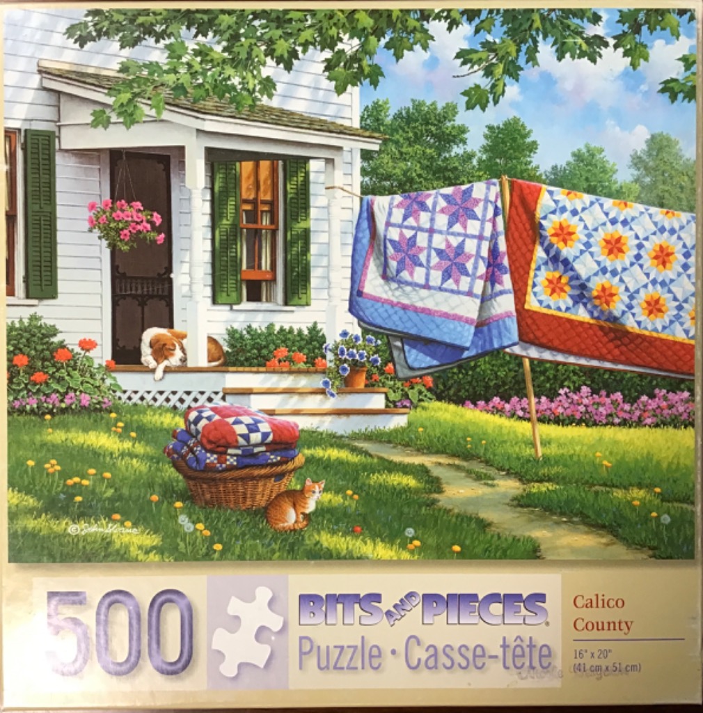 A peaceful country scene with quilts drying on a line, a white porch, a sleeping dog, and a ginger cat in the grass.