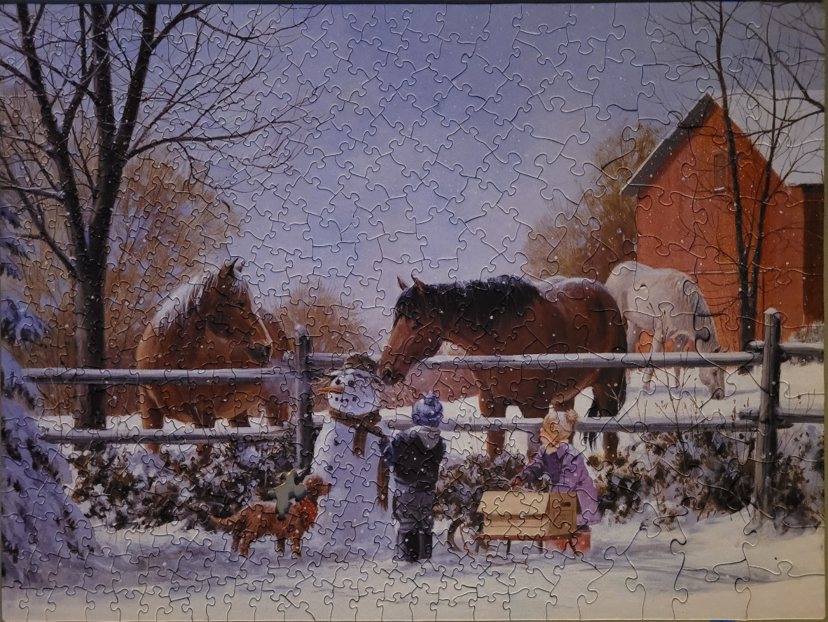 A nostalgic winter scene with two children, a snowman, a dog, and three horses by a wooden fence near a red barn.