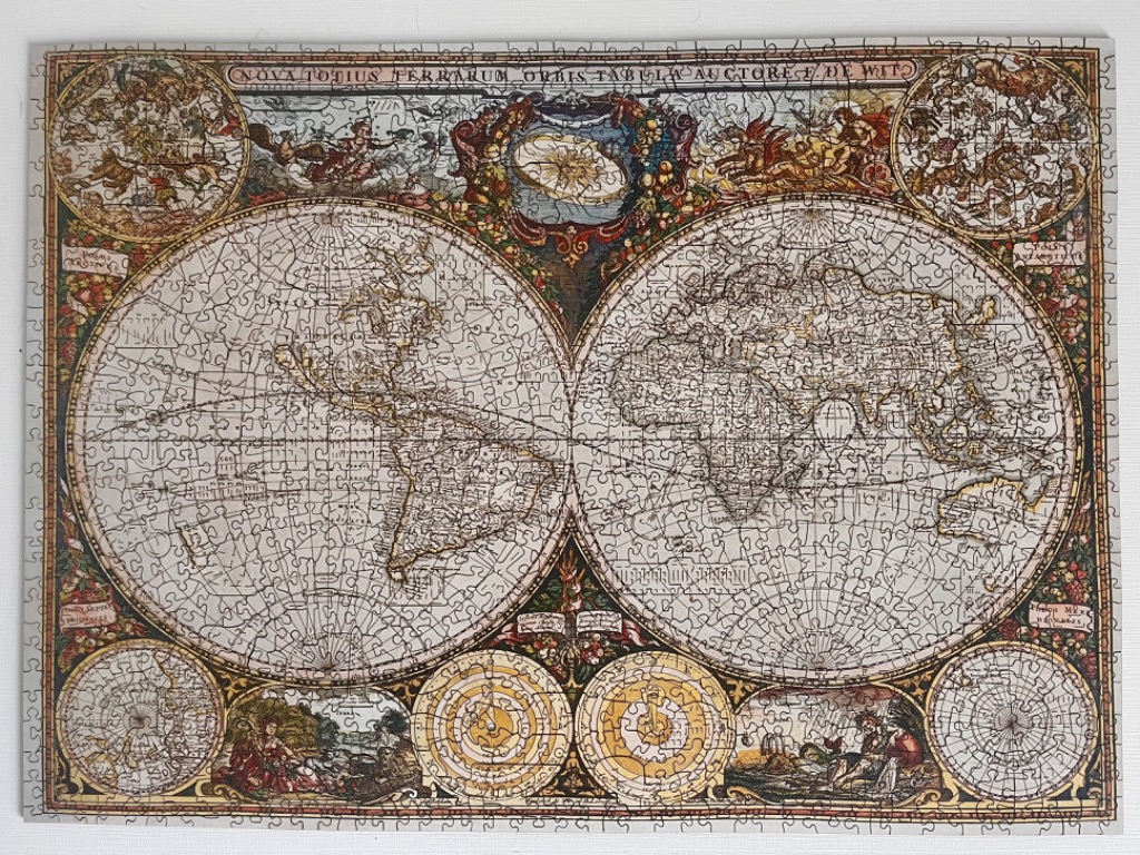 A vintage-style antique world map featuring dual hemispheres, celestial illustrations, and ornate cartographic borders.