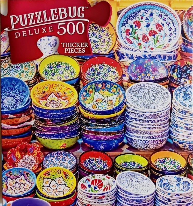 An array of colorful, patterned ceramic bowls stacked in rows.
