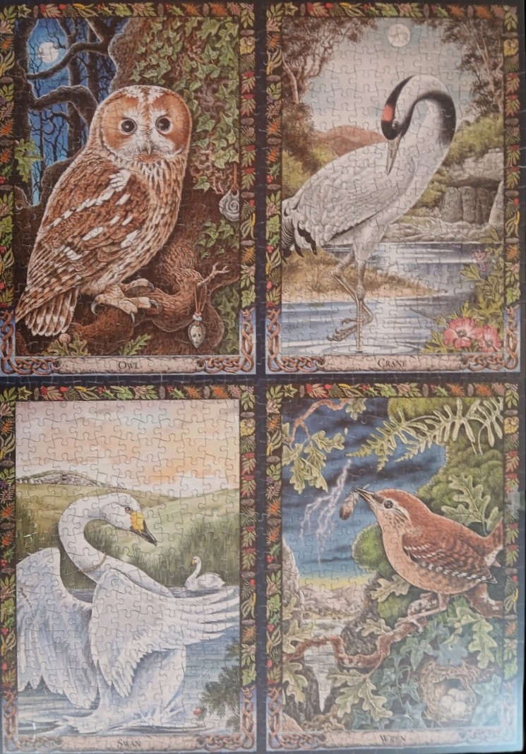 Four-panel illustration of an owl, crane, swan, and wren surrounded by decorative borders.