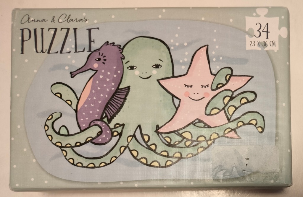 Illustration of a friendly octopus, seahorse, and starfish in soft pastel tones.