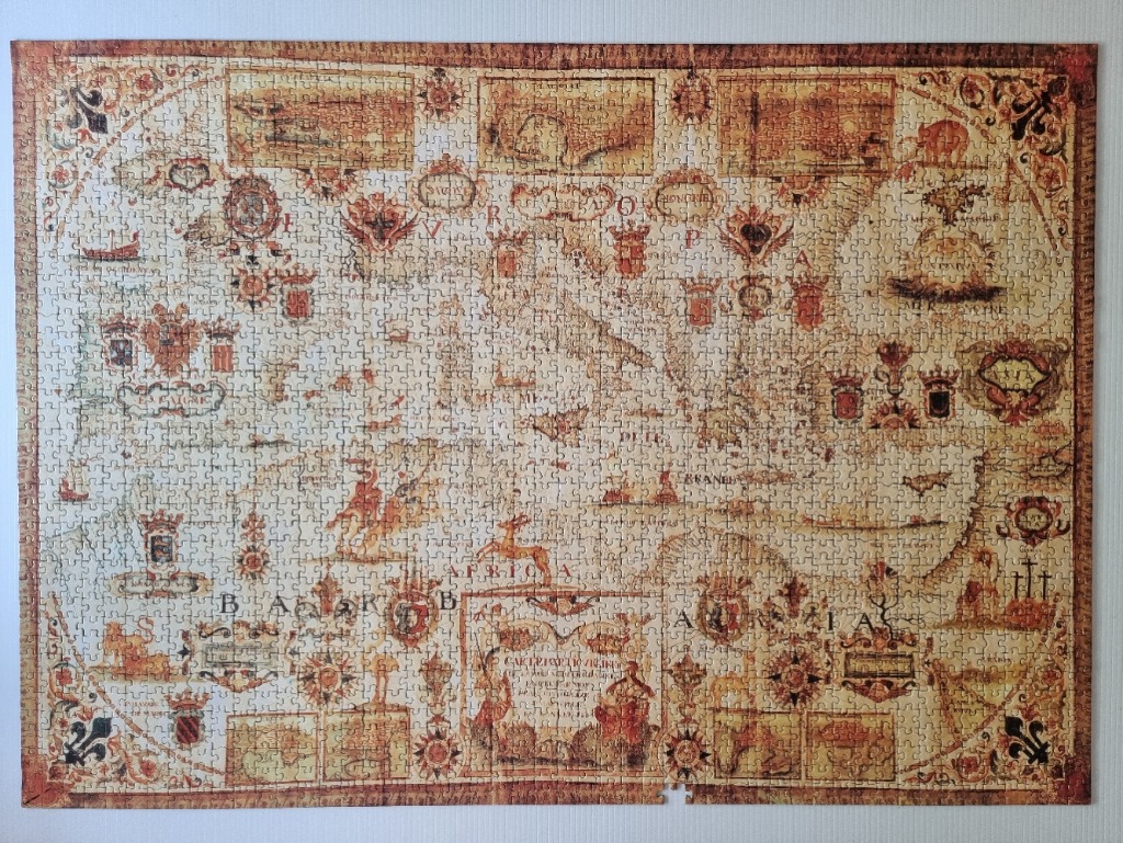 An antique-style map of the Mediterranean region featuring decorative heraldry and historical illustrations.