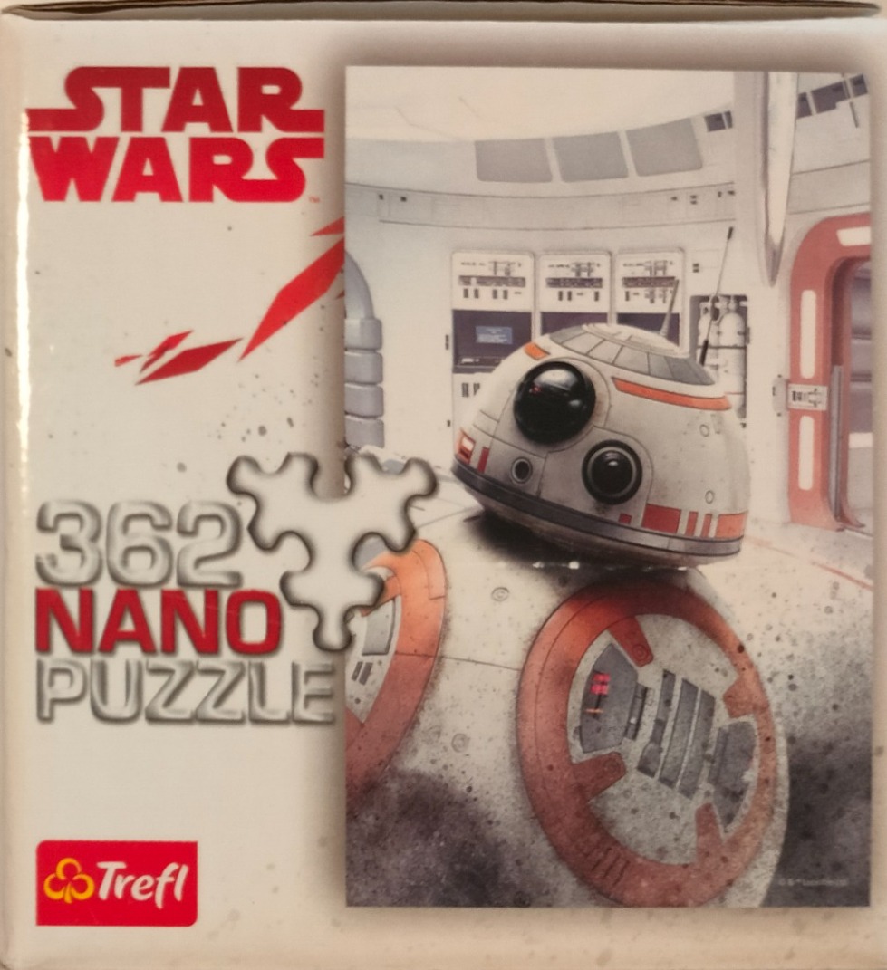 BB-8 droid standing in a white spaceship corridor