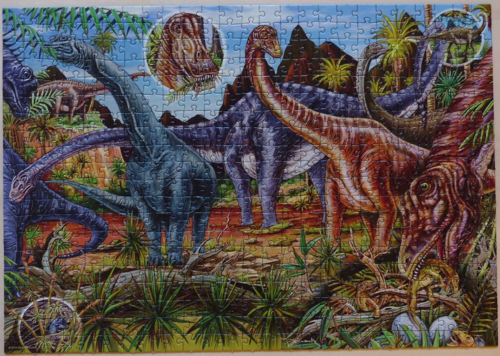 A lush prehistoric landscape filled with various sauropod dinosaurs.