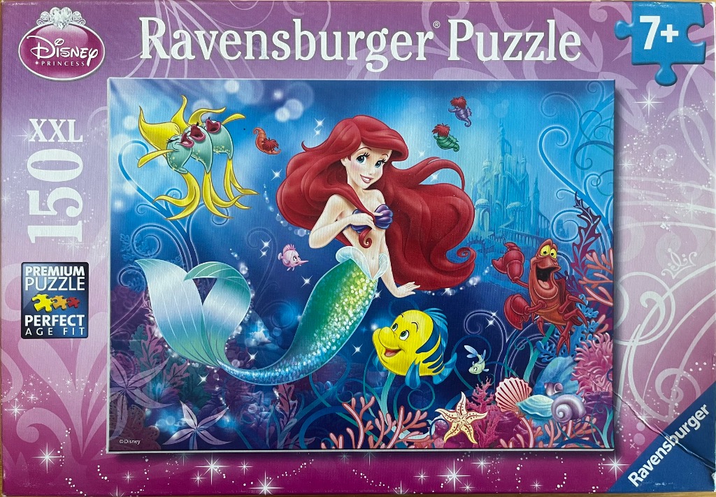 A cartoon illustration of Ariel the mermaid, Flounder, and Sebastian under the sea.