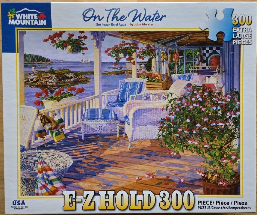 Painting of a cozy coastal porch with wicker furniture and views of the sea, flowers, and nautical decor.