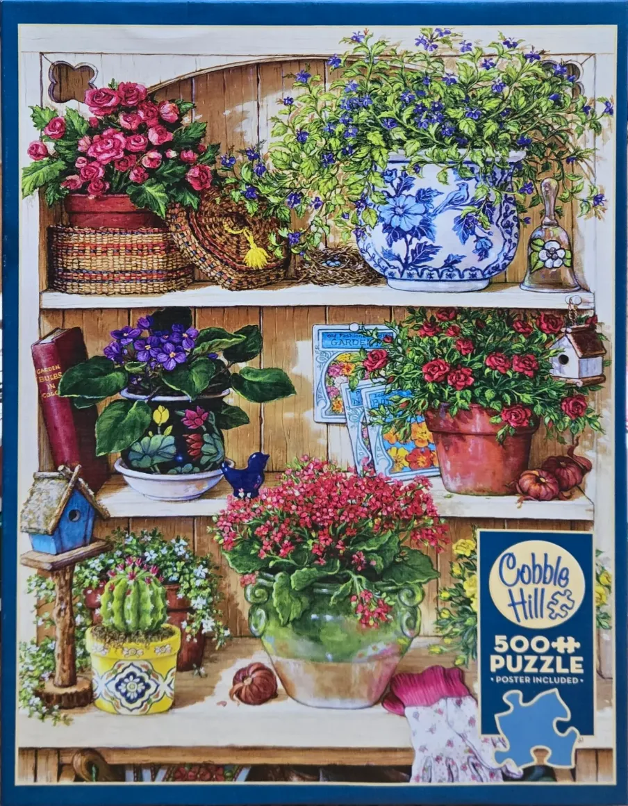 A three-tiered wooden shelf filled with various potted flowers, gardening tools, and decorative garden items.