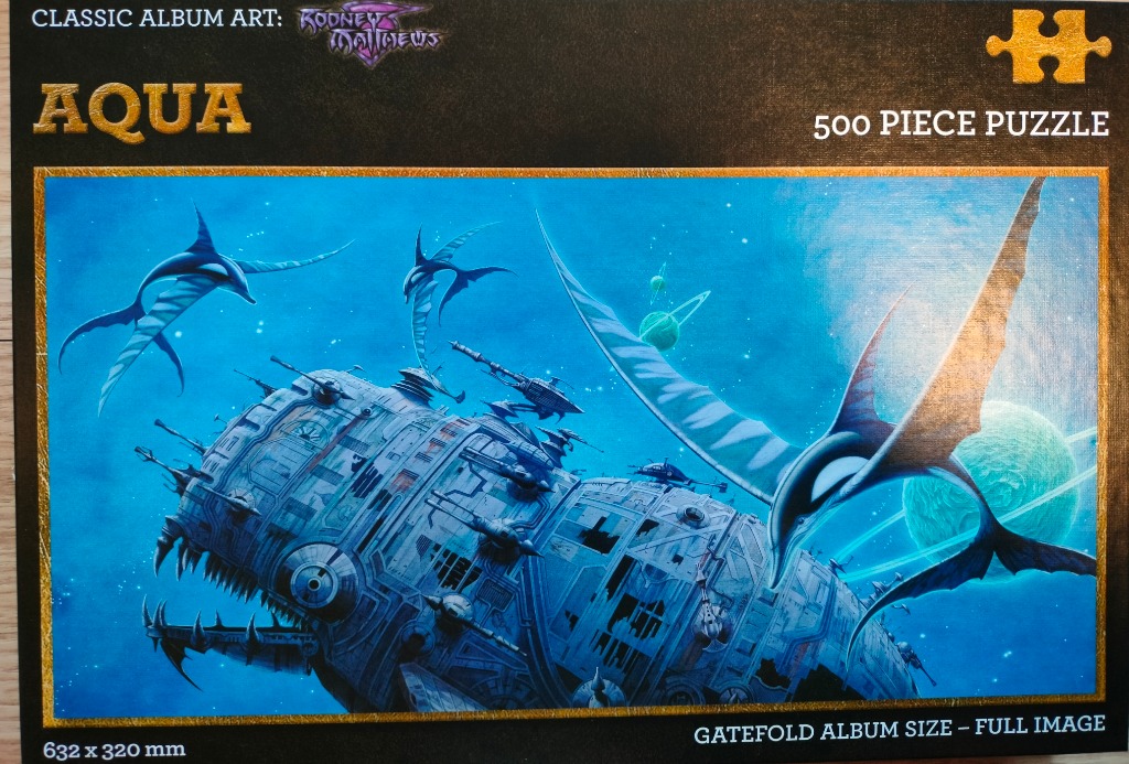 Fantasy illustration of a mechanical, whale-like space vessel floating in a blue cosmic ocean with winged creatures.