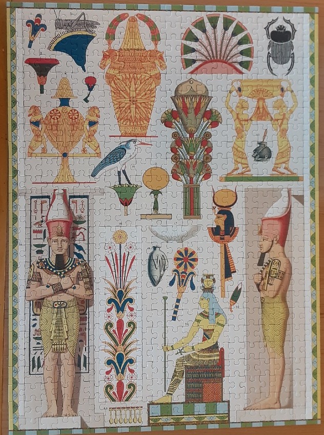 An illustration of various Ancient Egyptian artifacts, figures, and symbols arranged in a grid-like composition.