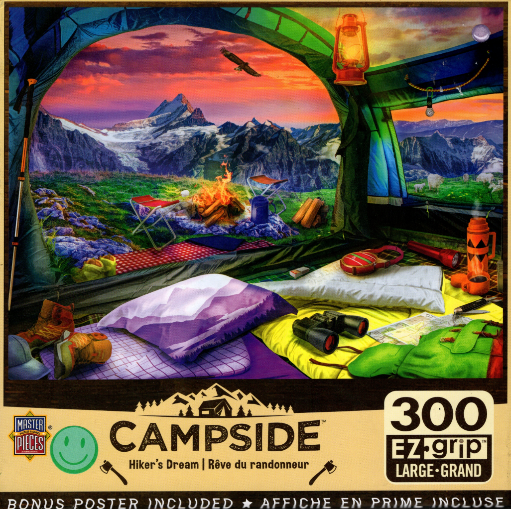Interior view of a tent looking out at a sunset mountain landscape with camping gear in the foreground.