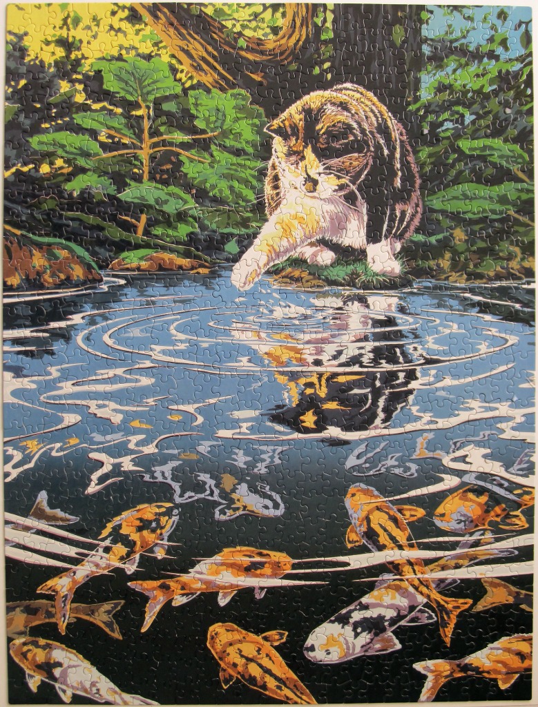 A calico cat reaches a paw toward a pond filled with koi fish.