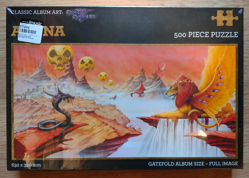 Surreal fantasy landscape featuring a winged, multi-eyed lion and a dark serpent facing off in a glowing orange wasteland.