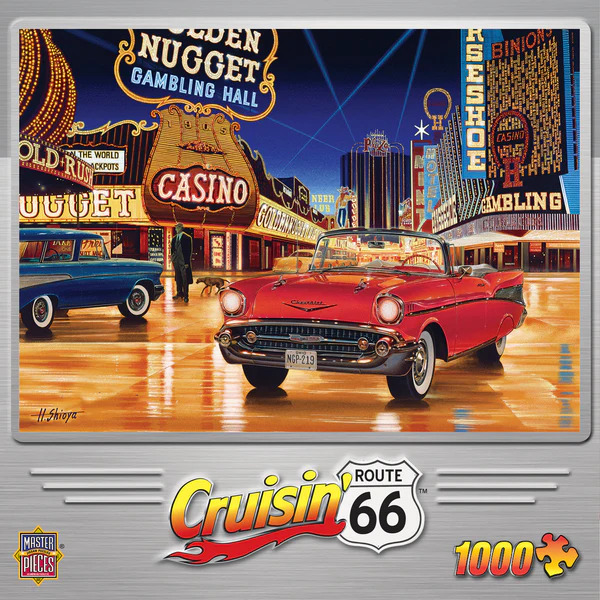 A red vintage convertible parked on a wet street in front of glowing Las Vegas casinos at night.