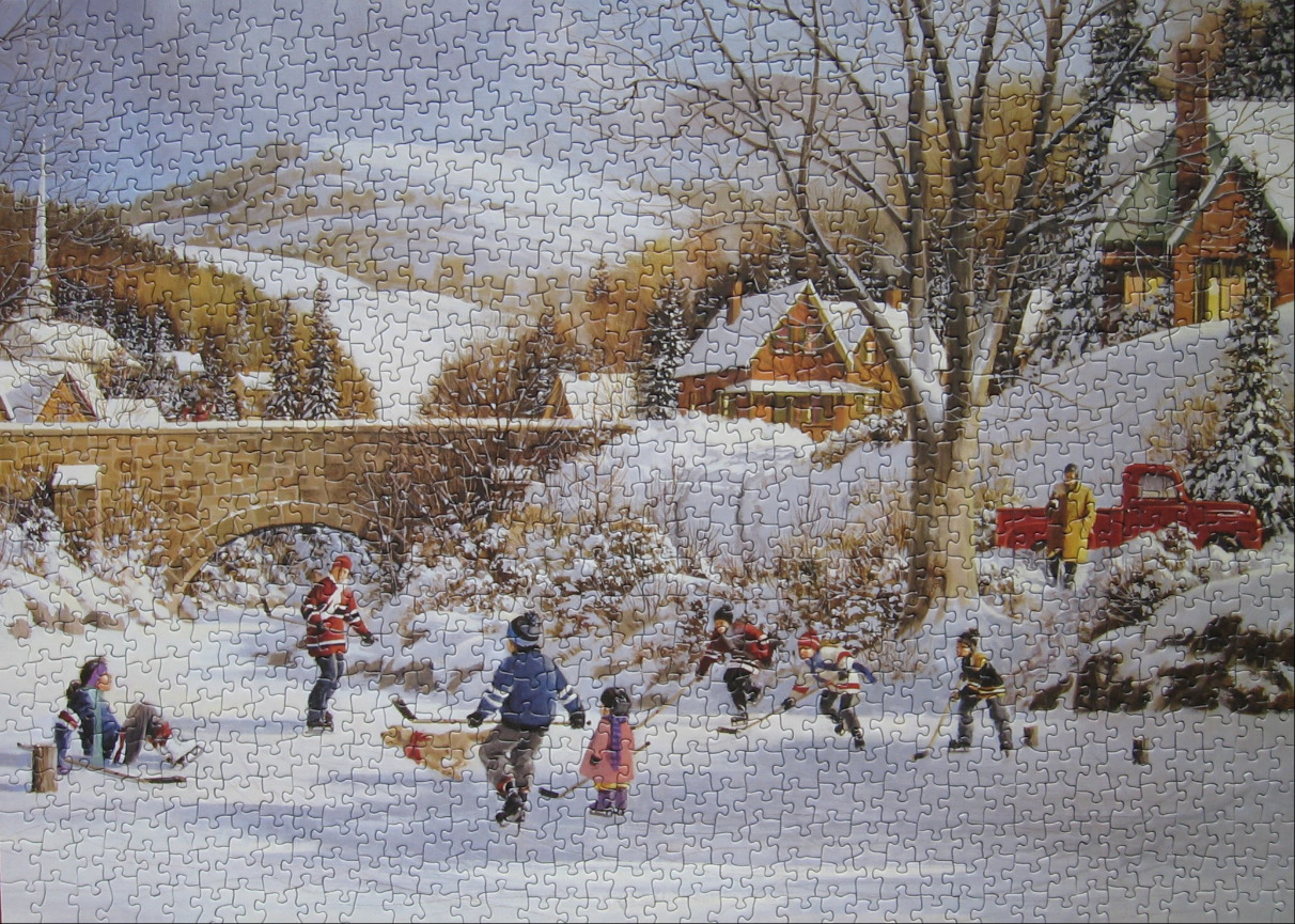 A wintry scene featuring children playing ice hockey on a frozen pond in front of a snow-covered village.