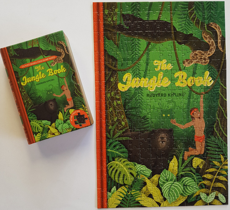 Book cover art of The Jungle Book featuring Mowgli, Baloo, Bagheera, and Kaa in a lush jungle setting.