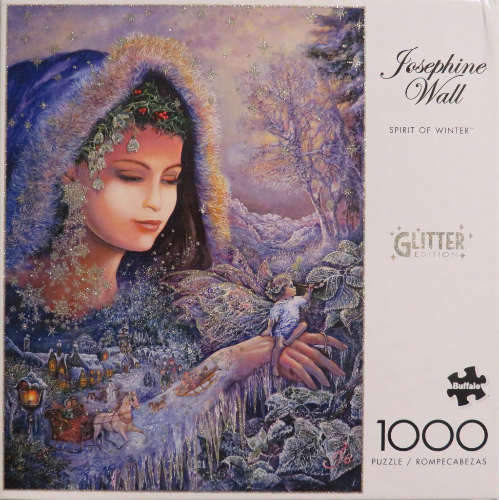 A large, ethereal woman draped in a fur-trimmed blue cloak looks over a snowy winter village scene.