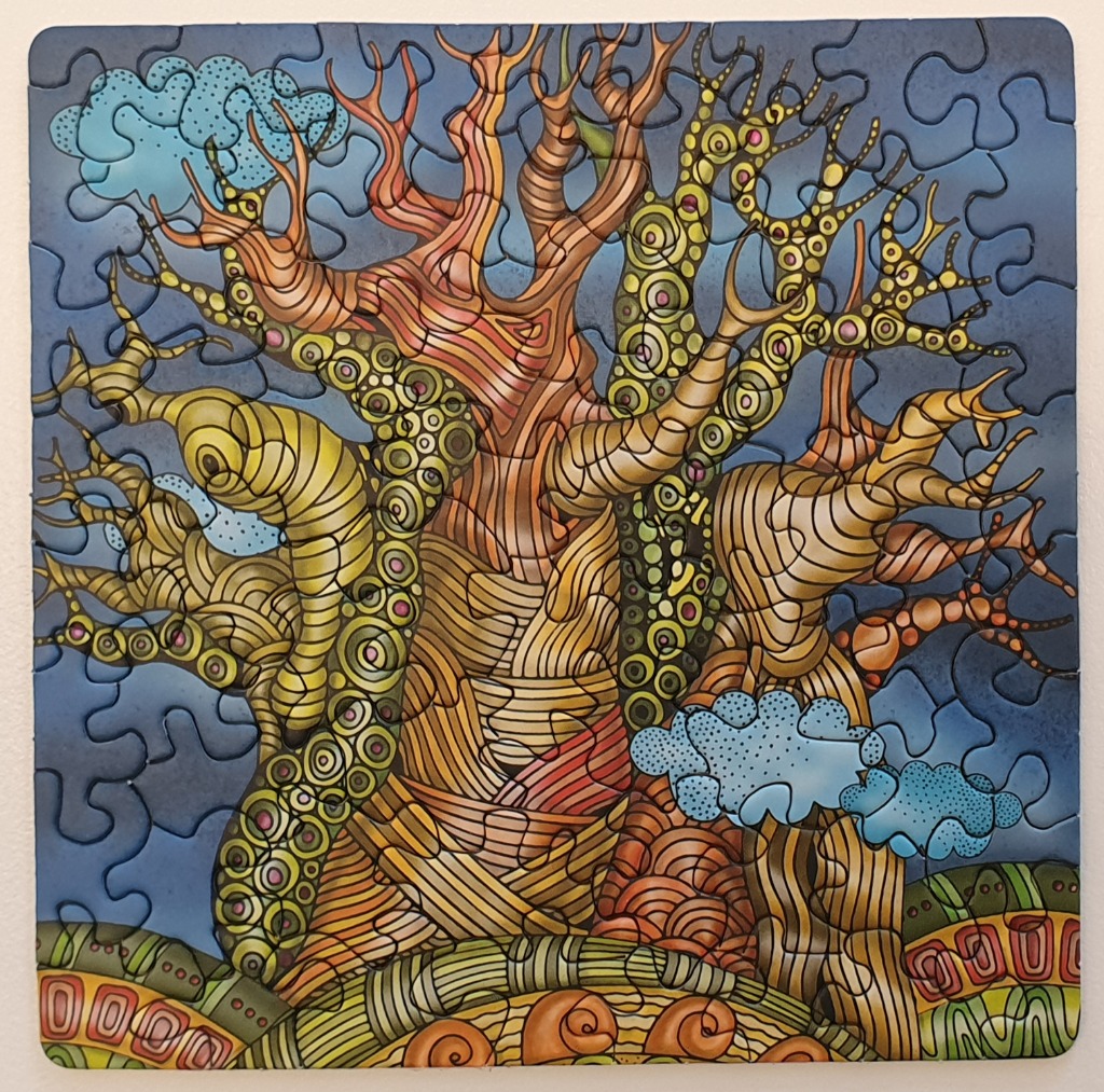 An illustration of a stylized, patterned baobab tree set against a dark blue sky with clouds.