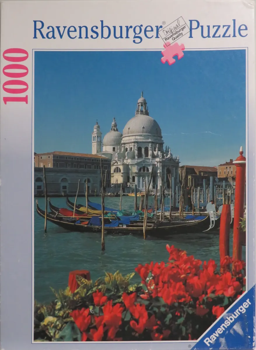 A photograph of the Santa Maria della Salute church in Venice, seen from across a canal with gondolas in the foreground.
