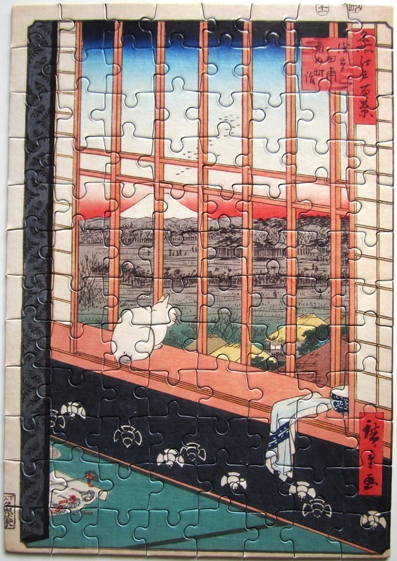 Ukiyo-e woodblock print featuring a white cat sitting in a window frame overlooking a landscape with Mount Fuji.