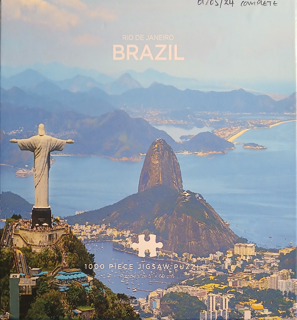 The Christ the Redeemer statue overlooking Sugarloaf Mountain and the Rio de Janeiro coastline.