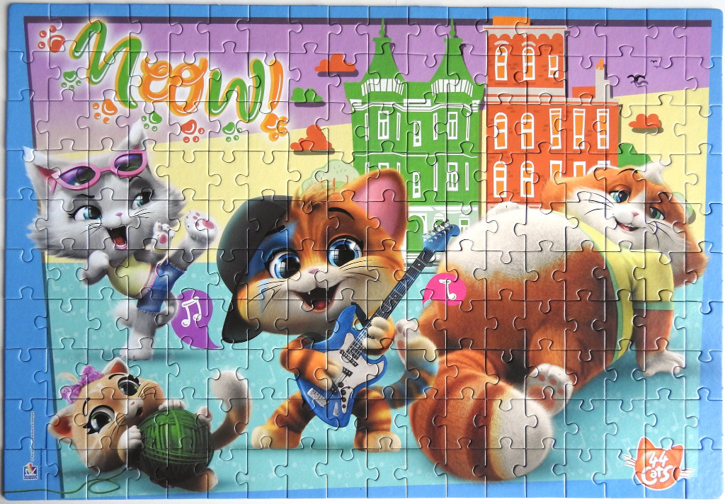 Illustration of four animated kittens playing music and having fun against a city background.