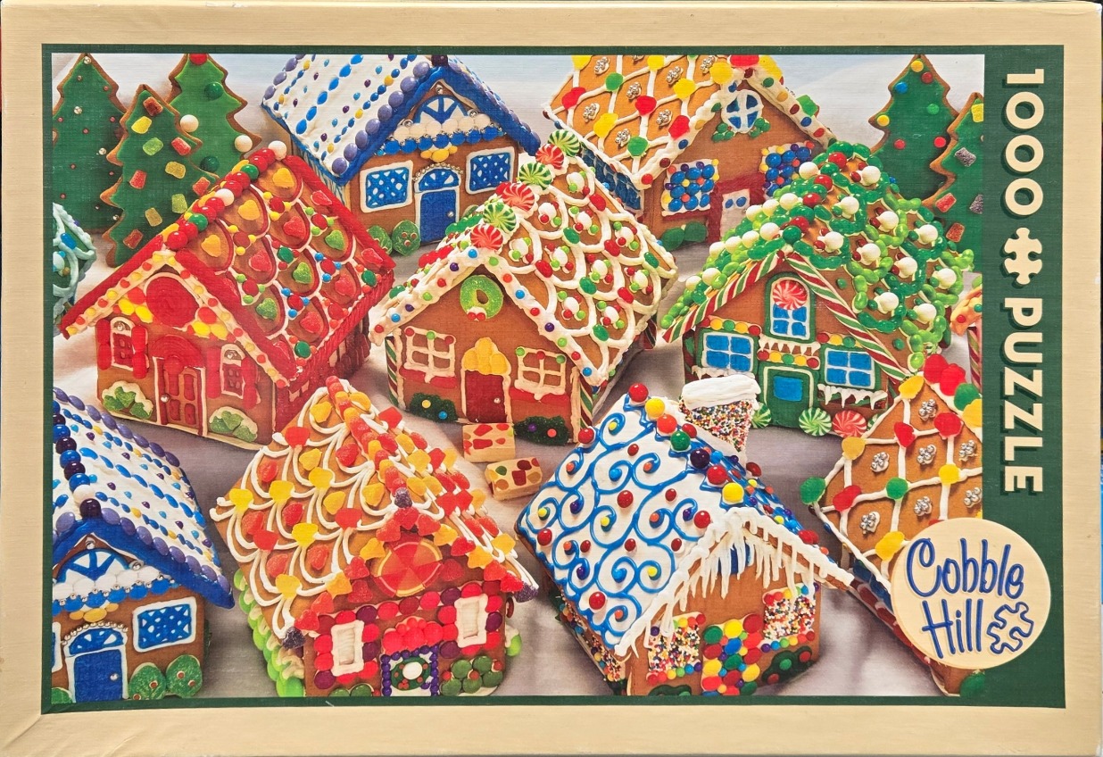 A village of multiple gingerbread houses decorated with colorful candy, icing, and gumdrops.