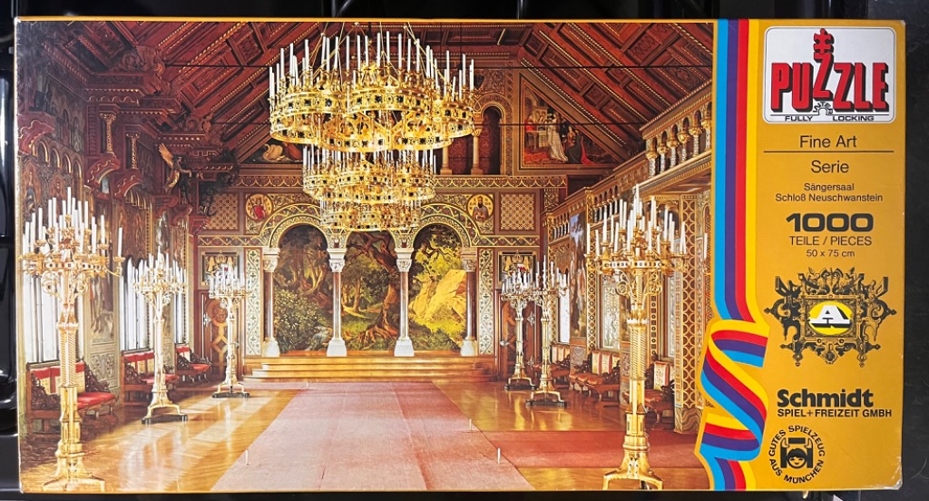 The ornate Singers' Hall of Neuschwanstein Castle featuring a grand chandelier and golden candelabras.