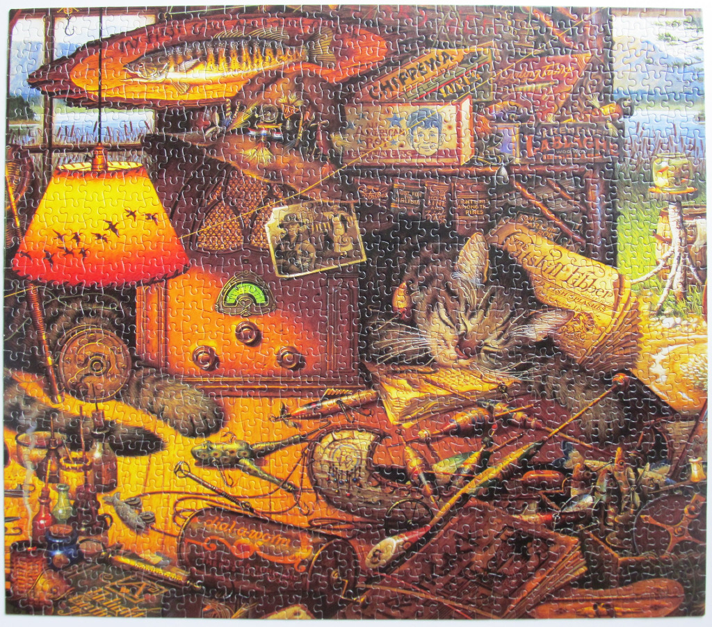 A cozy, warm-toned illustration of a sleepy tabby cat surrounded by fishing gear and vintage cabin decor.