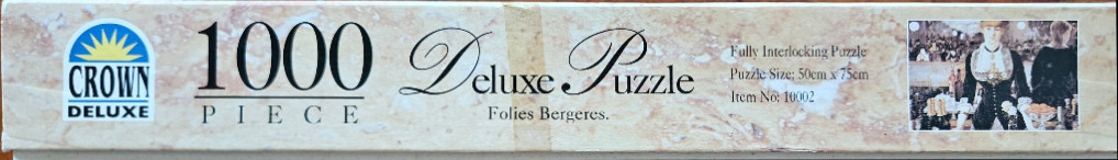 Side panel of a jigsaw puzzle box featuring the title Folies Bergeres, a 1000-piece count, and puzzle dimensions.