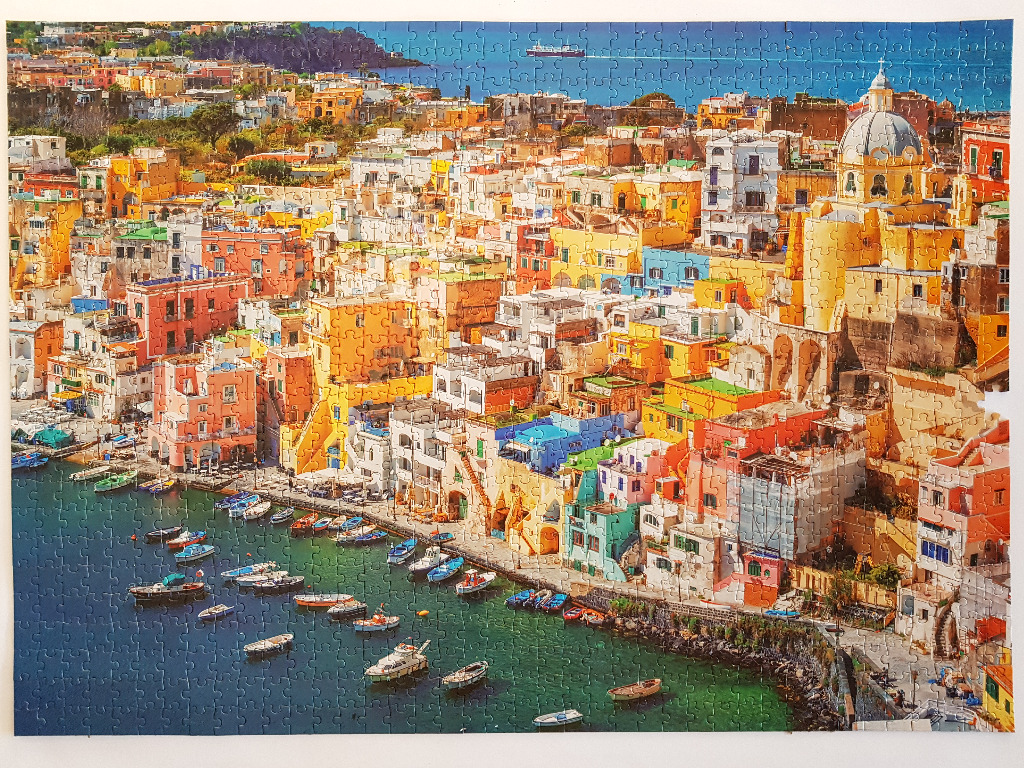Aerial view of the colourful buildings and marina in Procida, Italy