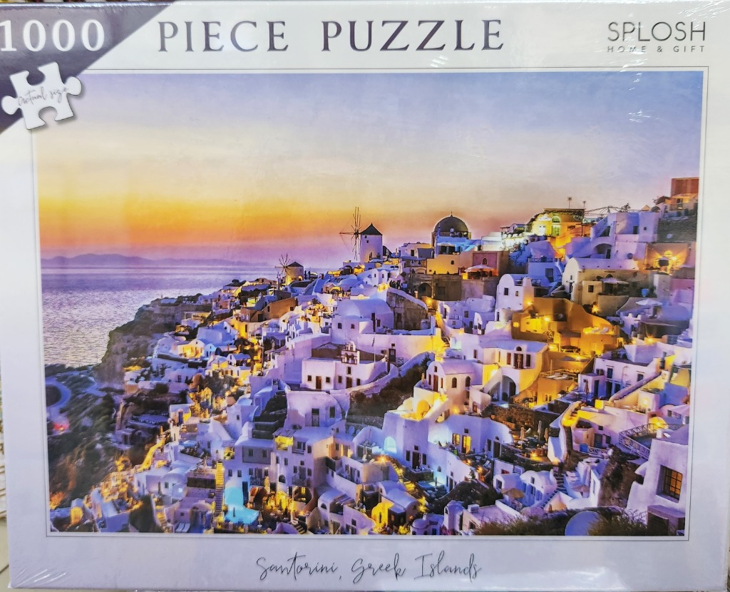 Sunset view over white buildings in Santorini, Greece