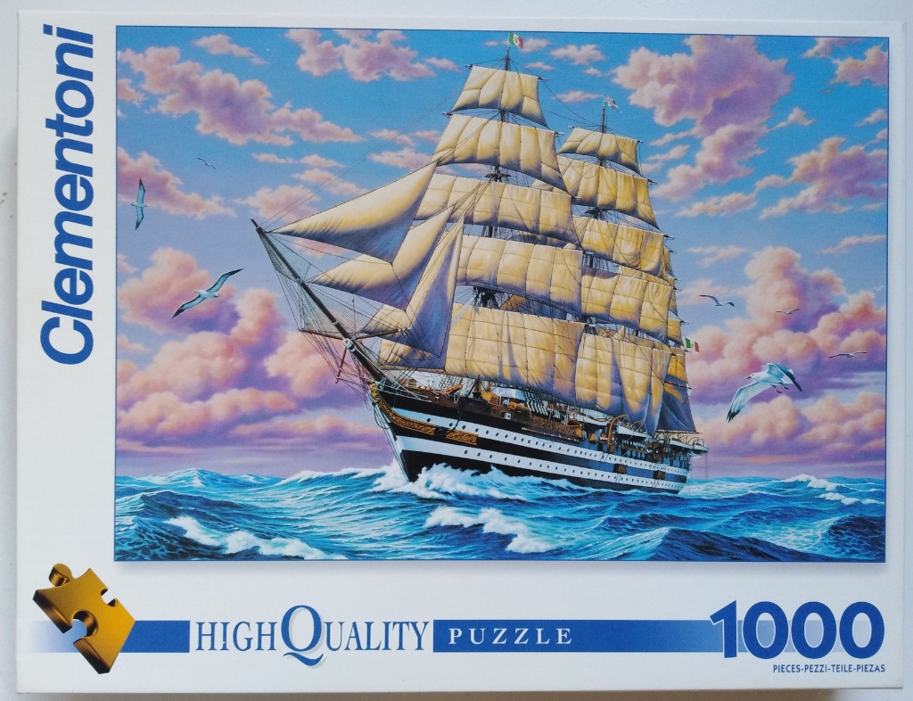 A majestic tall ship sailing across a choppy blue ocean at sunset with pink and orange clouds in the sky.