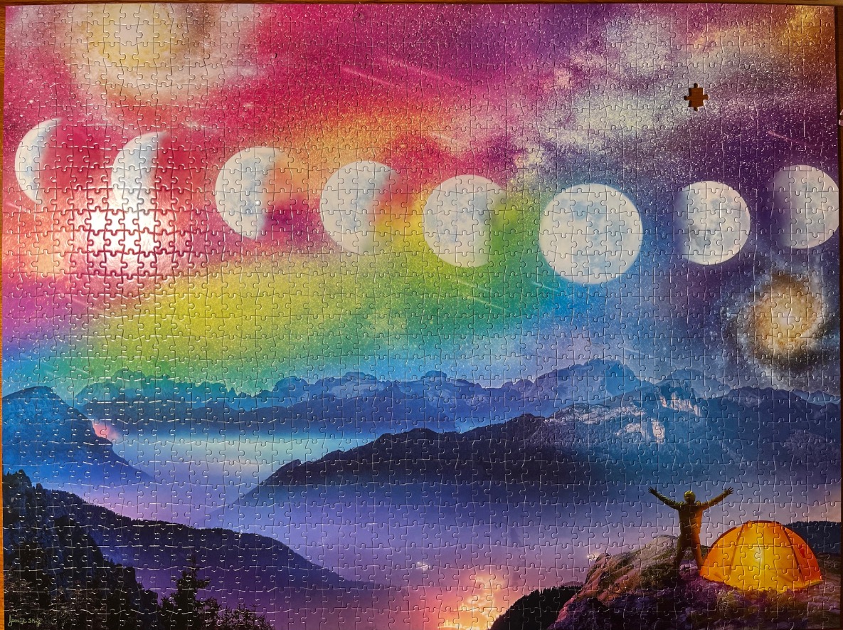 A hiker stands by an orange tent overlooking a mountain range under a vibrant, rainbow-colored night sky with moon phases.