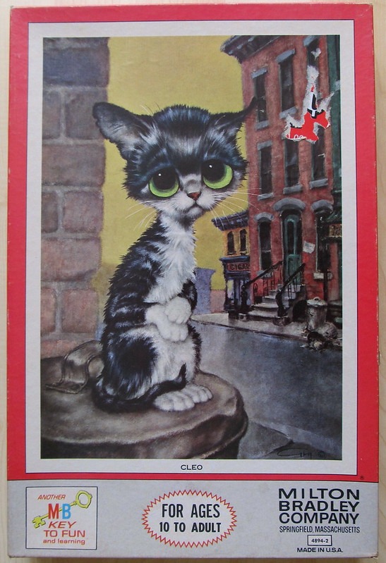 A cartoon illustration of a sad-looking black and white kitten with large green eyes sitting on a trash can in a city.