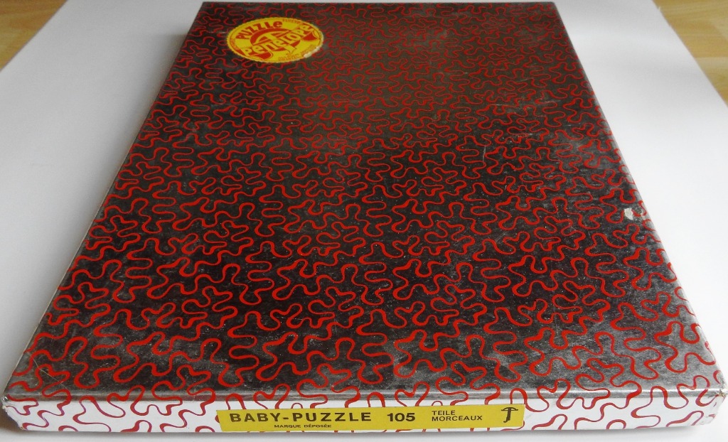 A repeating pattern of interconnected red organic squiggles on a black background.